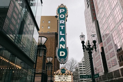 vertical green sign that reads "Portland"