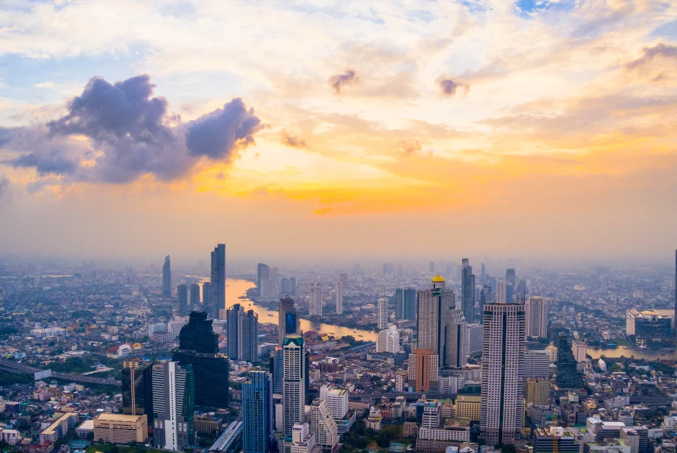 A skyline view of Bangkok at sunset. 
