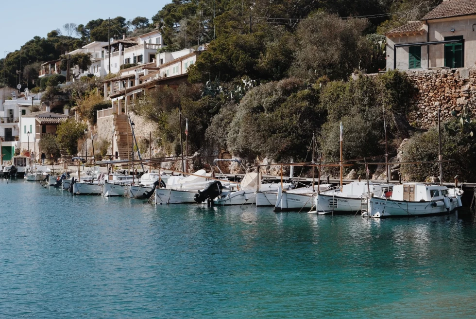 White sailboats in the water in Mallorca, Spain