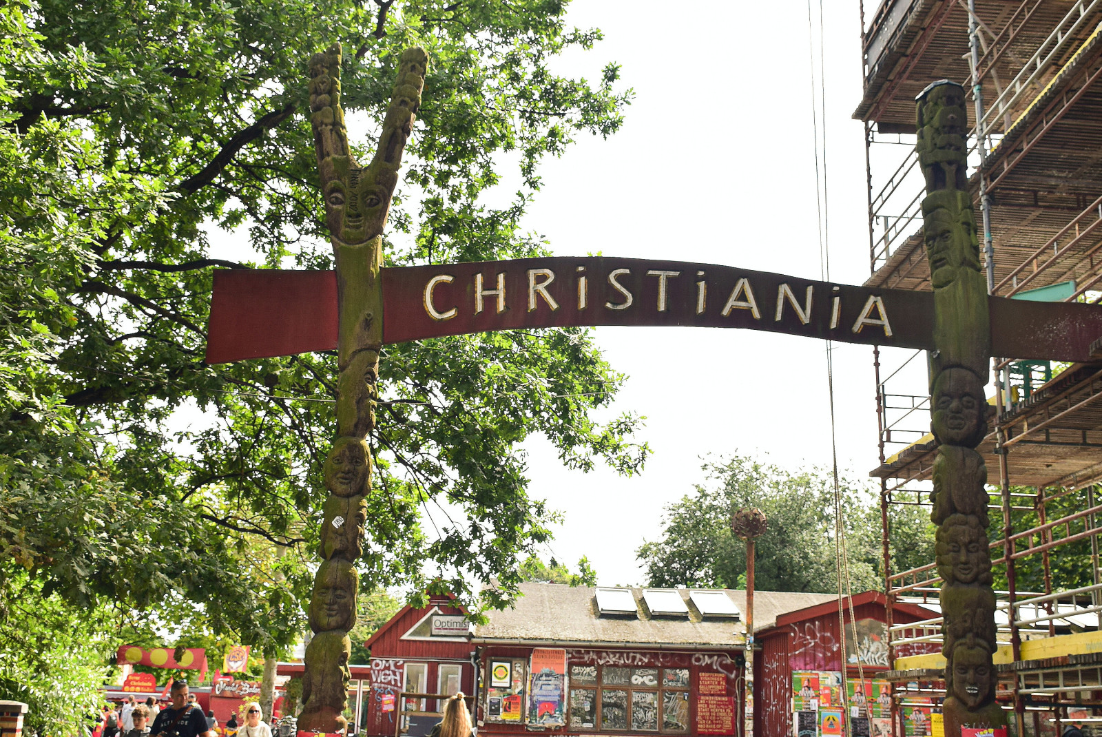 Street in Denmark with tree and sign that reads "Christiana"