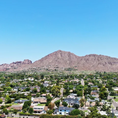 city next to mountains during daytime