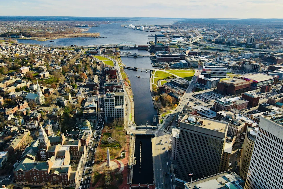 Aerial view of city with water body.