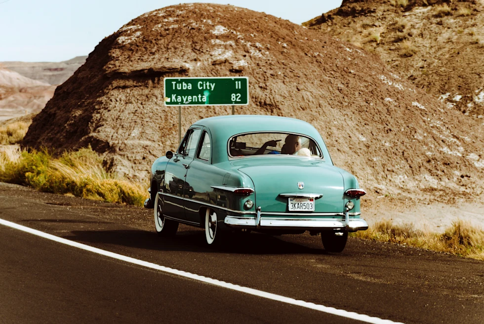 Car on the main highway with rocks in background