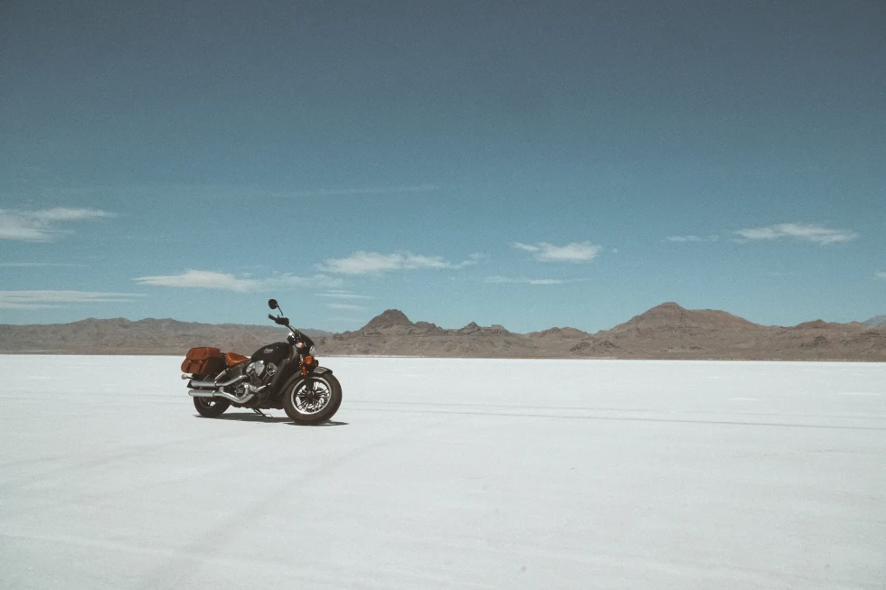motorcycle on a large salt flat during daytime