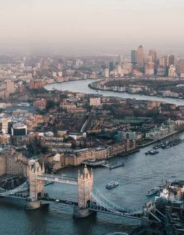 An aerial view of London's cityscape complete with a bridge and canal.