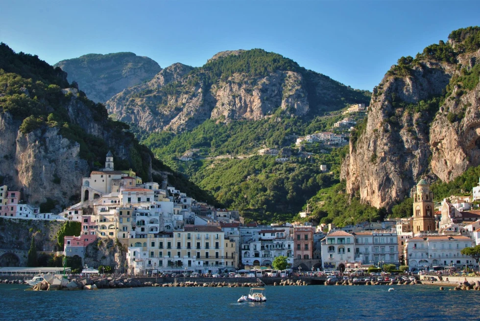 island with rocky mountains and many buildings