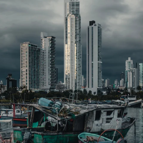 Panama City skyline framed by old fishermen's boats. 