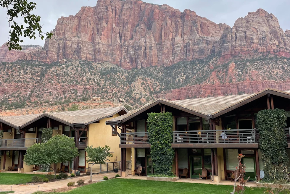 building with mountains in the background during daytime