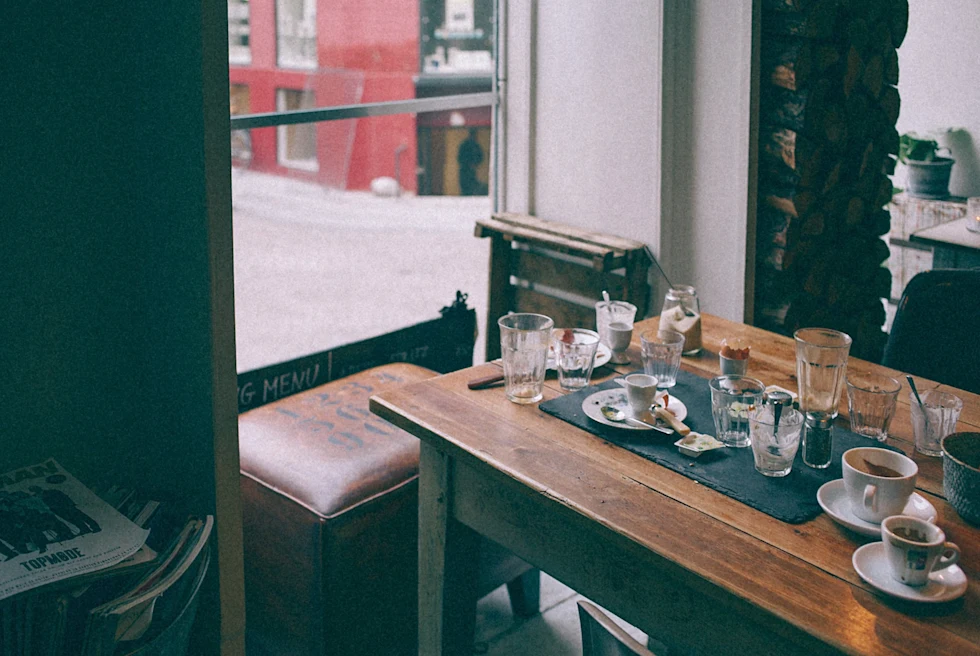 A dinning table with crockery items