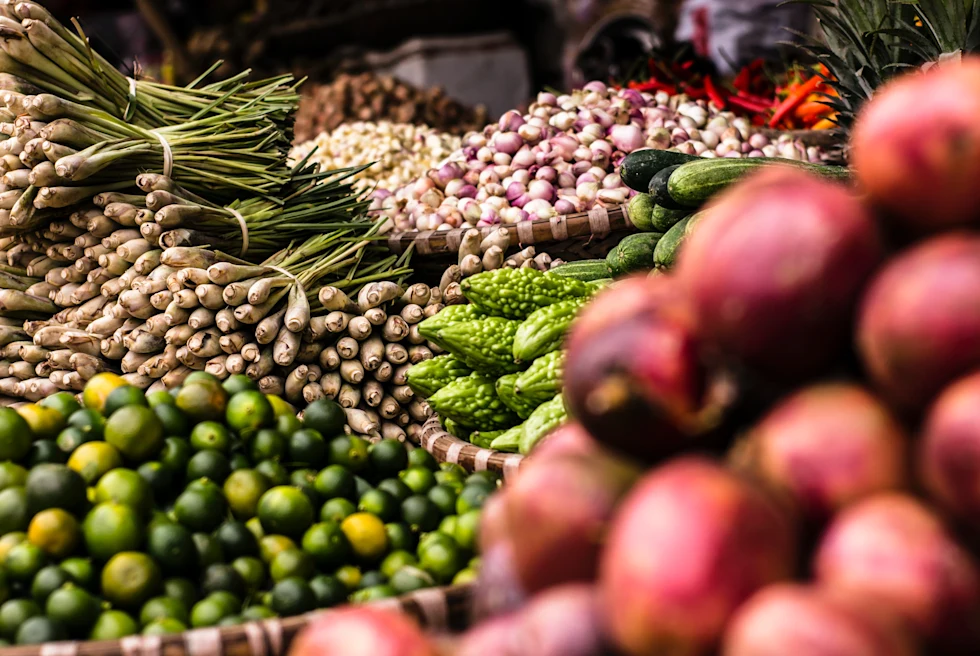 Red, green, and purple produce at a local farmers market