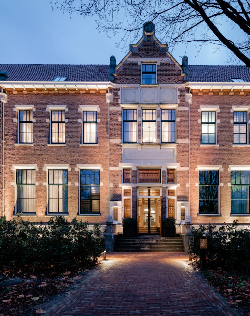 a handsome brick building at dusk