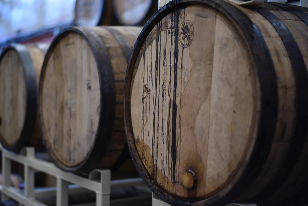 Wooden whiskey barrels.