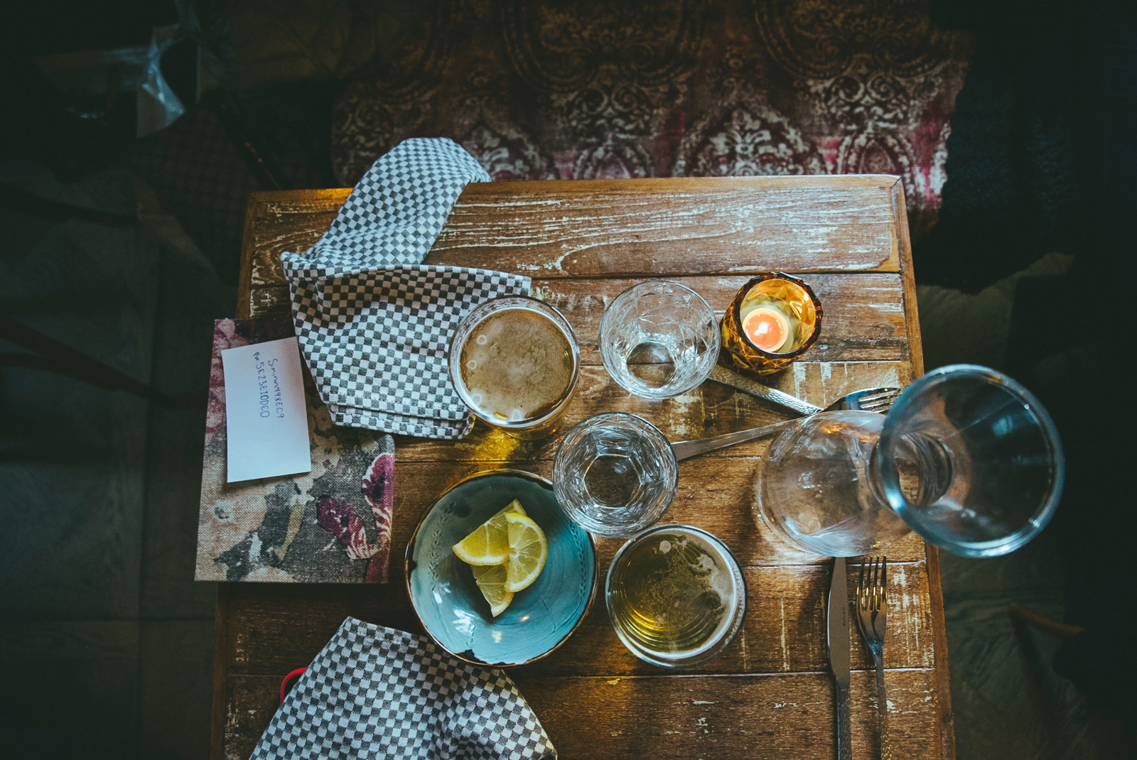 Aerial view of drinks and bowl of lemons on a wooden table in Reykjavik, Iceland