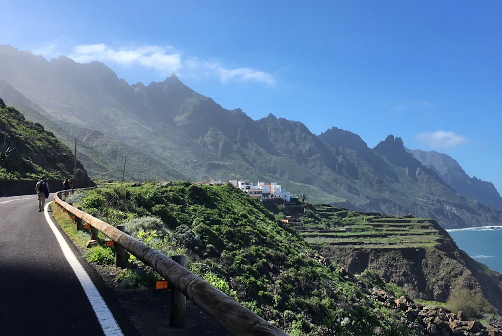 A scenic drive with mountains on one side and sea on the other.