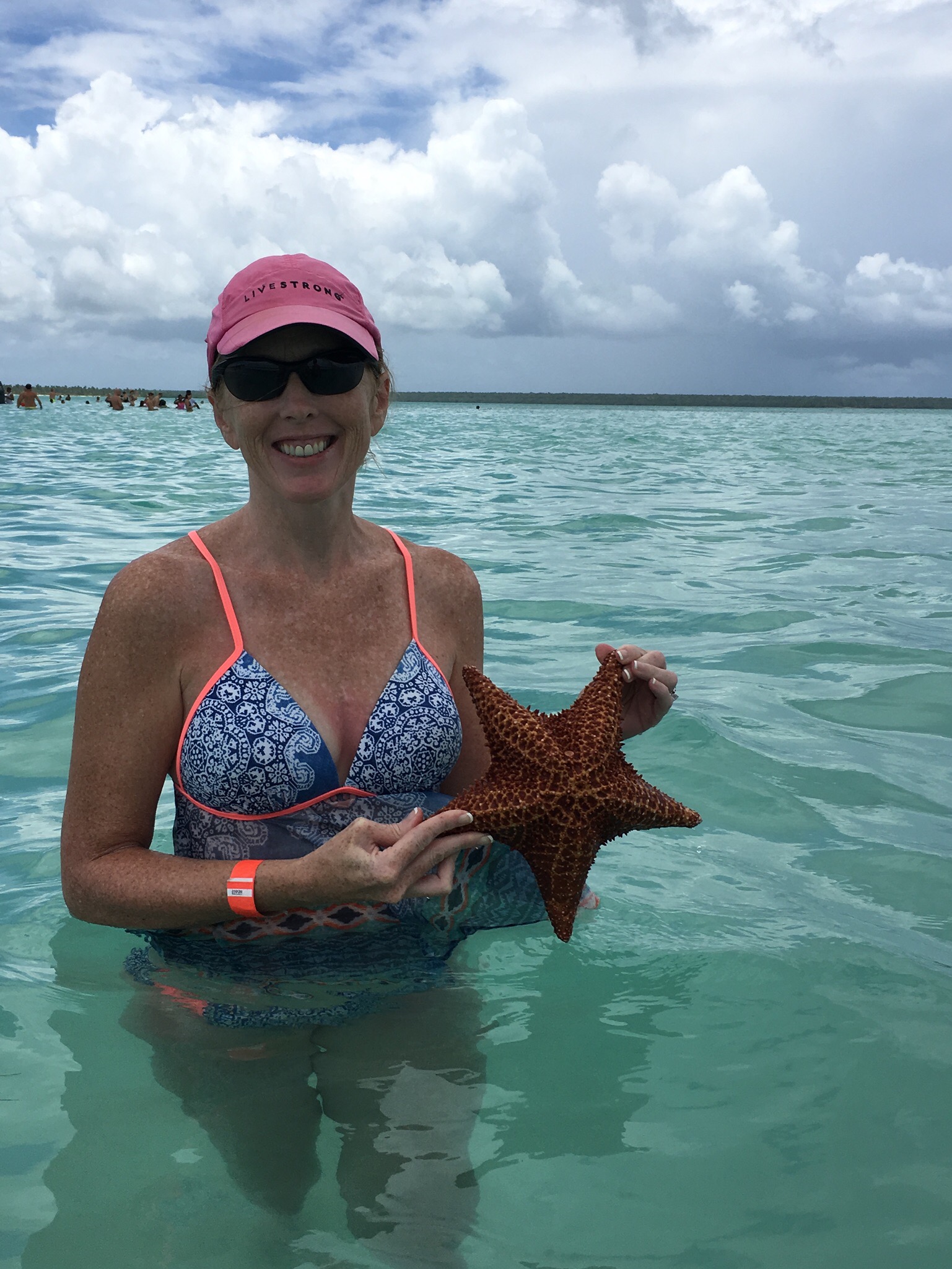 Picture of Jenifer with starfish in water