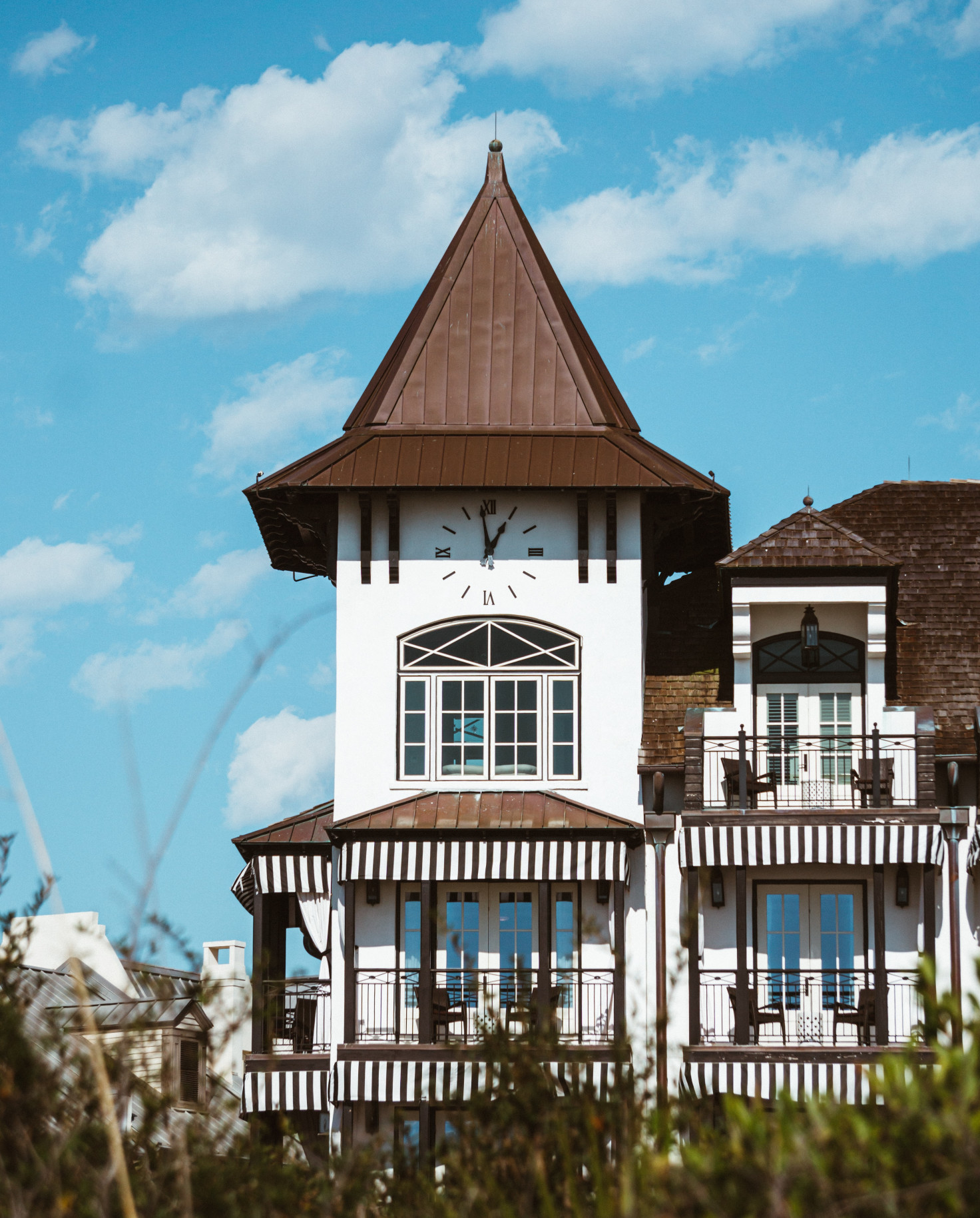 white building with brown roof during daytime