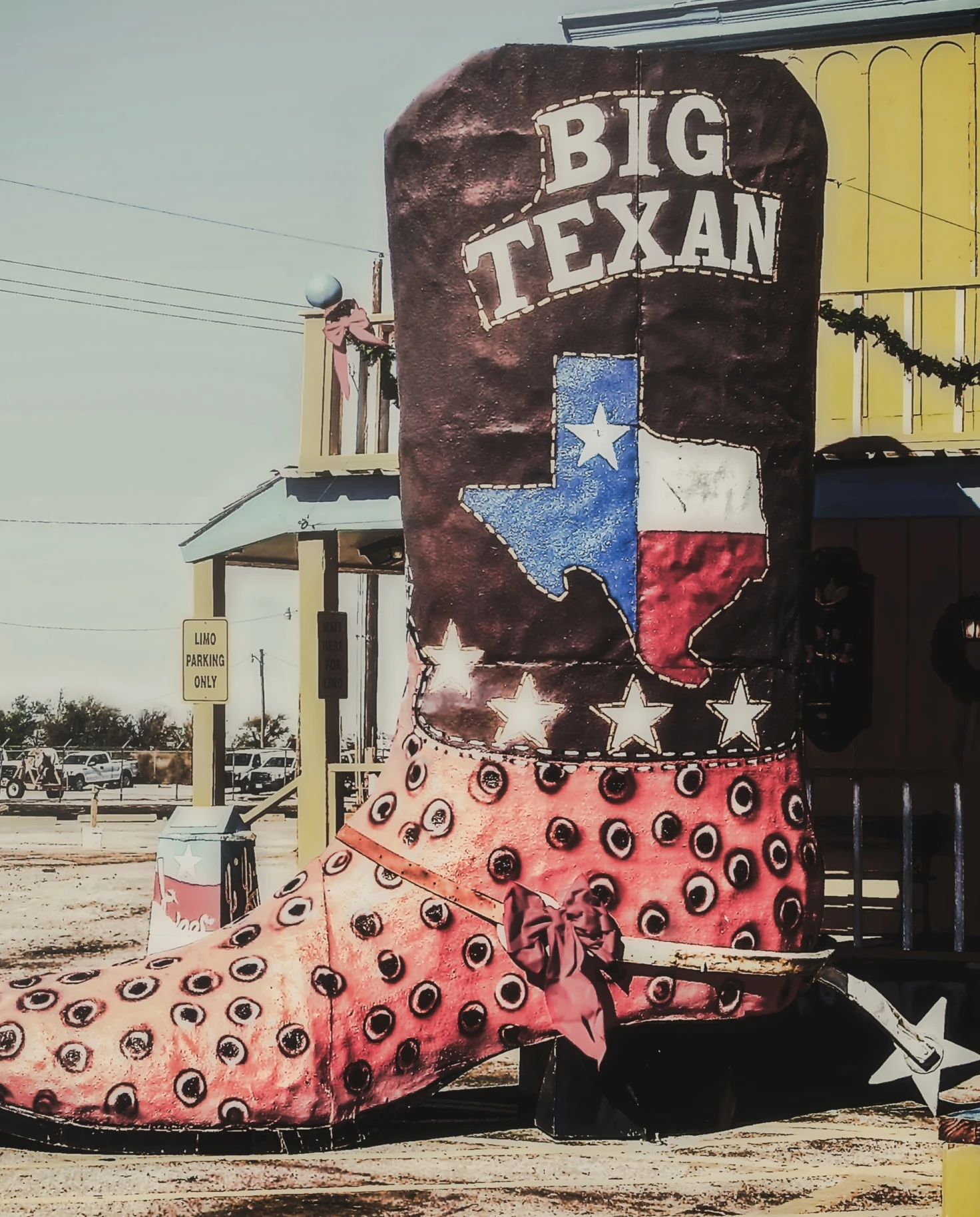 A long boot landmark with Texas flag and Big Texan written on it.