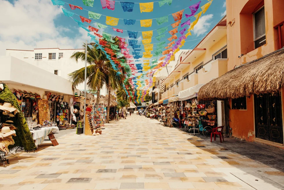 Outdoor market in Tulum on a sunny day, selling handmade goods.