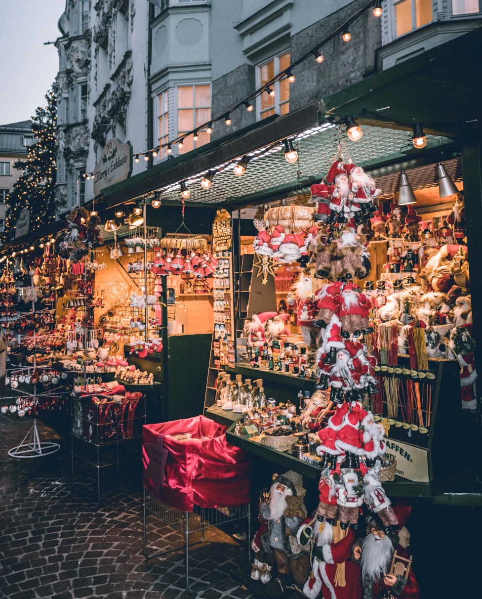 vendors selling holiday crafts and ornaments with twinkle lights