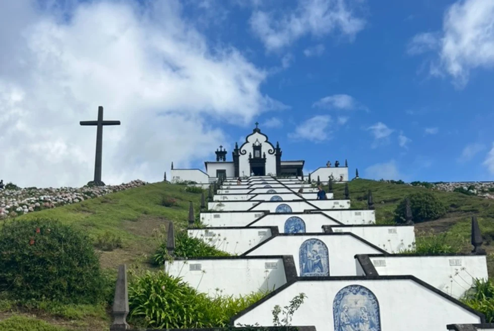 a landmark of white steps on a hill lead up the a church chapel