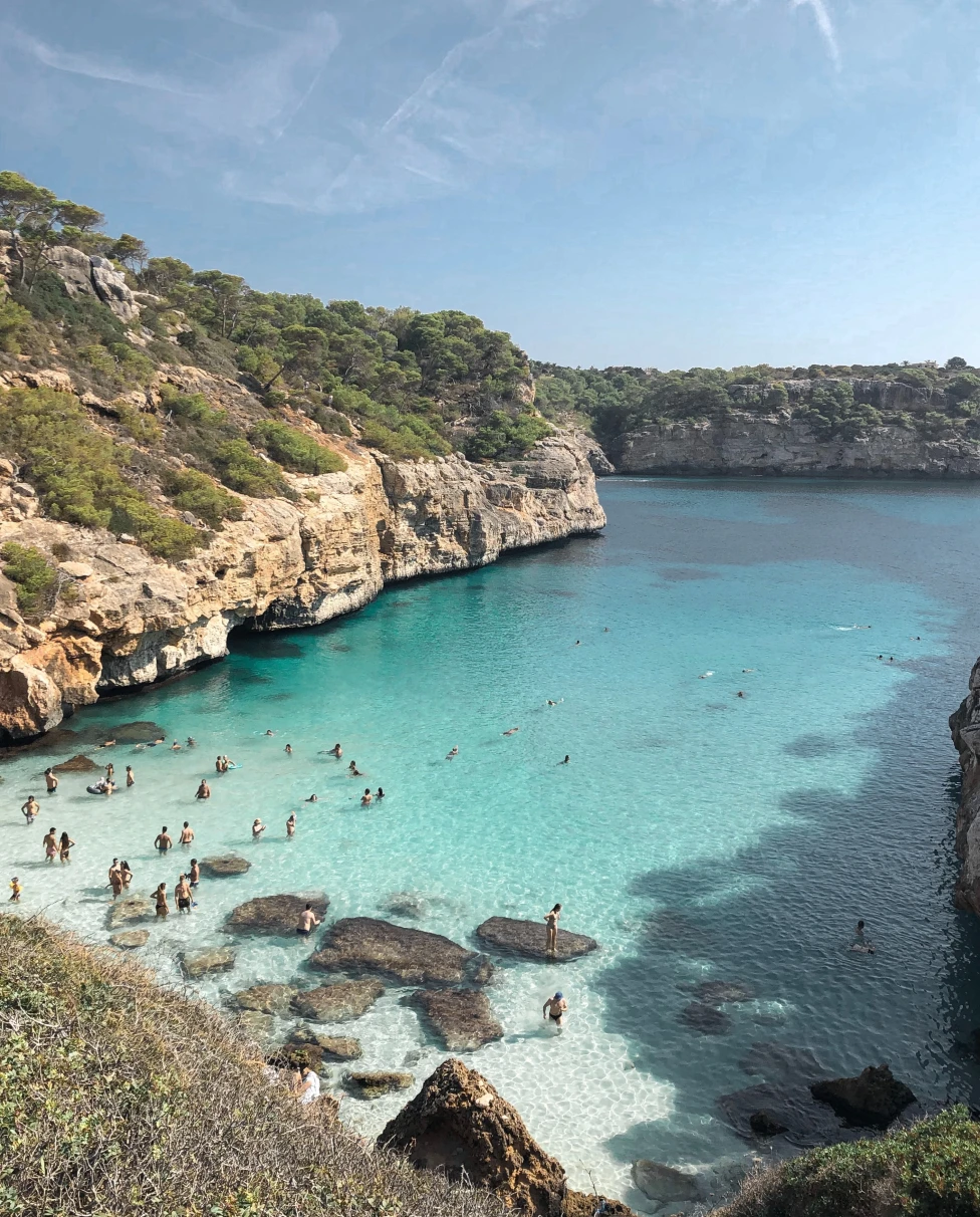 An azure blue cove on the island of Mallorca. 