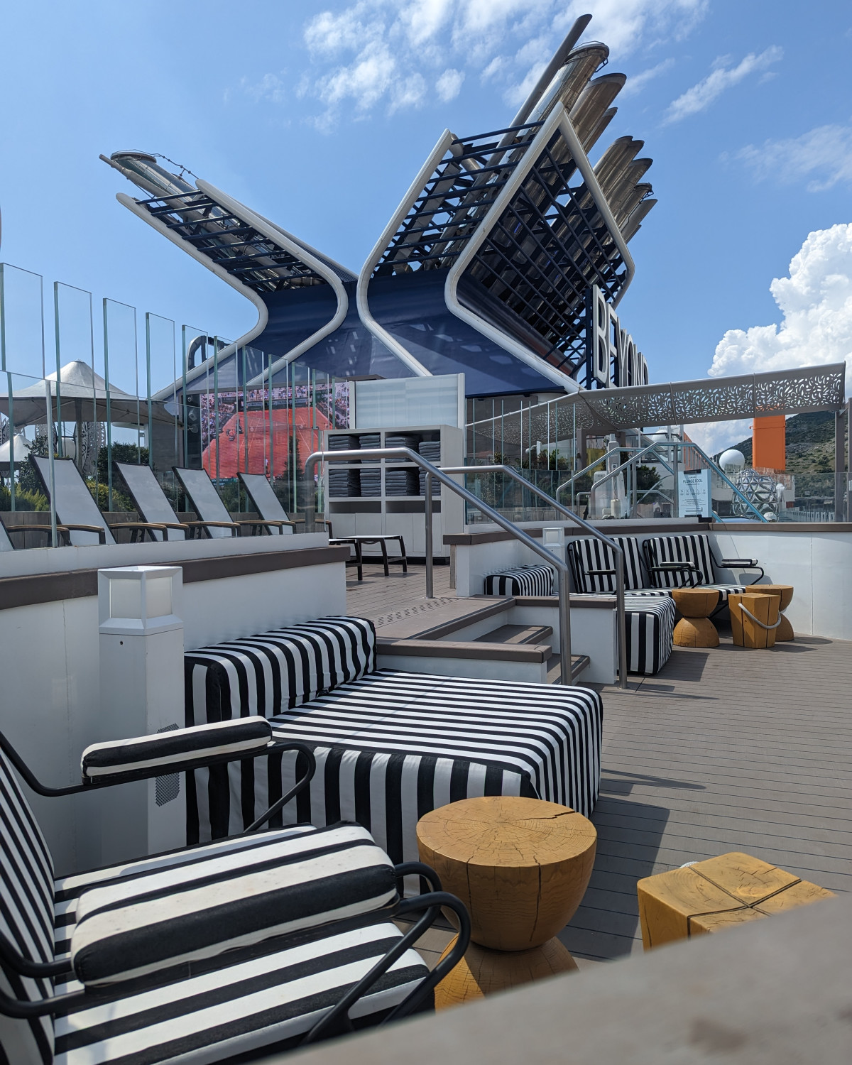 Deck of the ship with resting chairs and tables