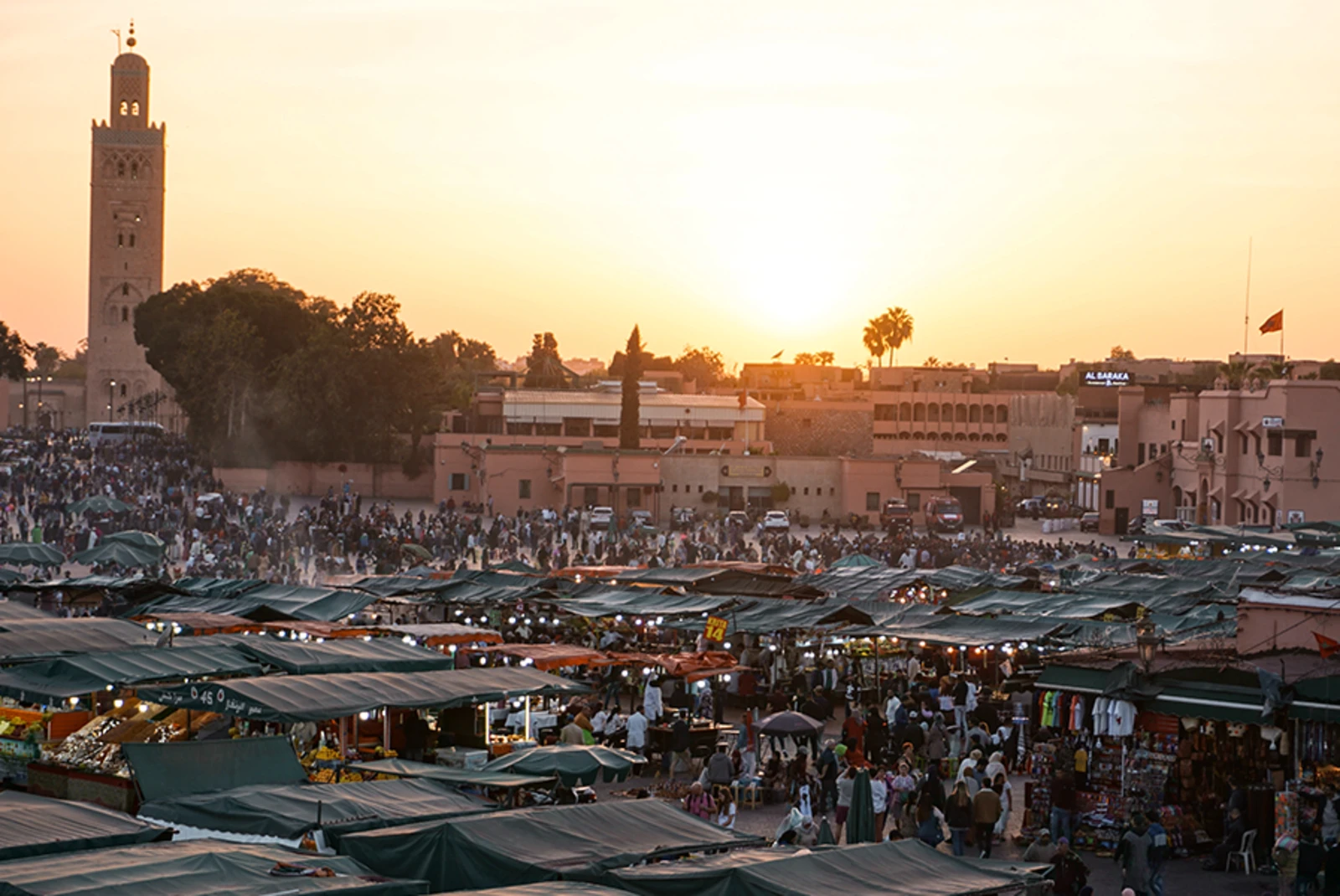 Morocco Marrakech night market sunset stands with green roofs 
