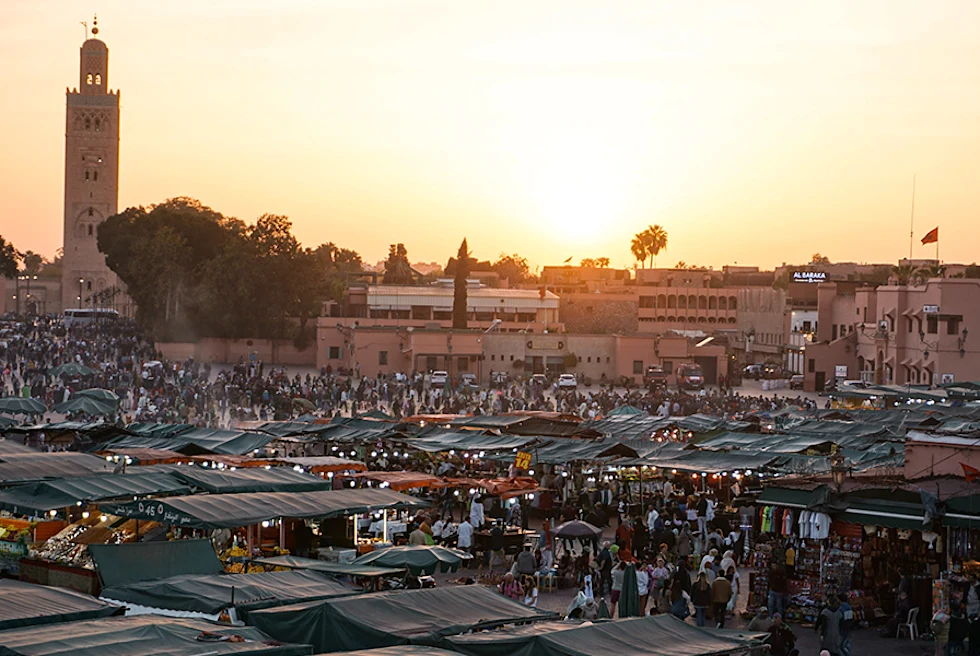 Morocco Marrakech night market sunset stands with green roofs