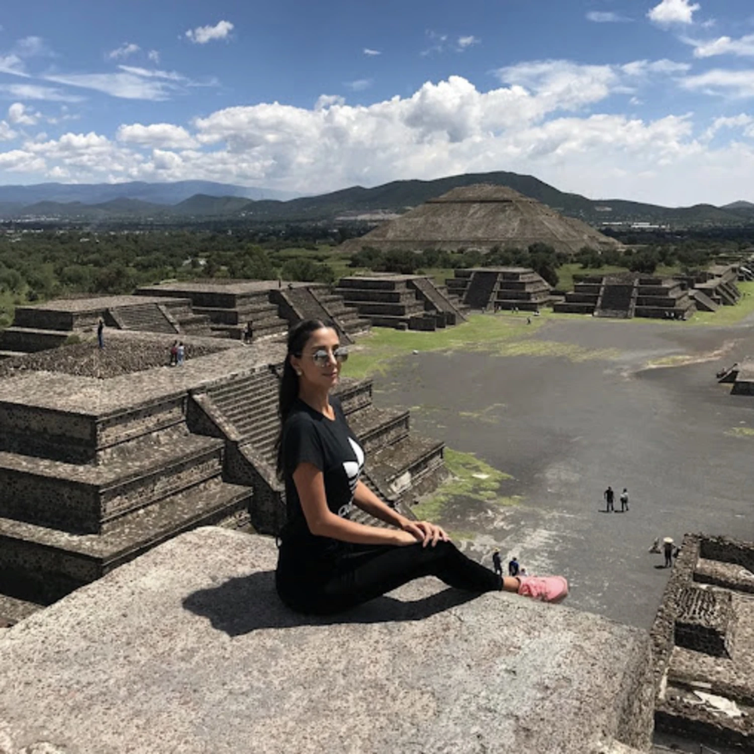 Girl sitting on a pyramid in Mexico. 