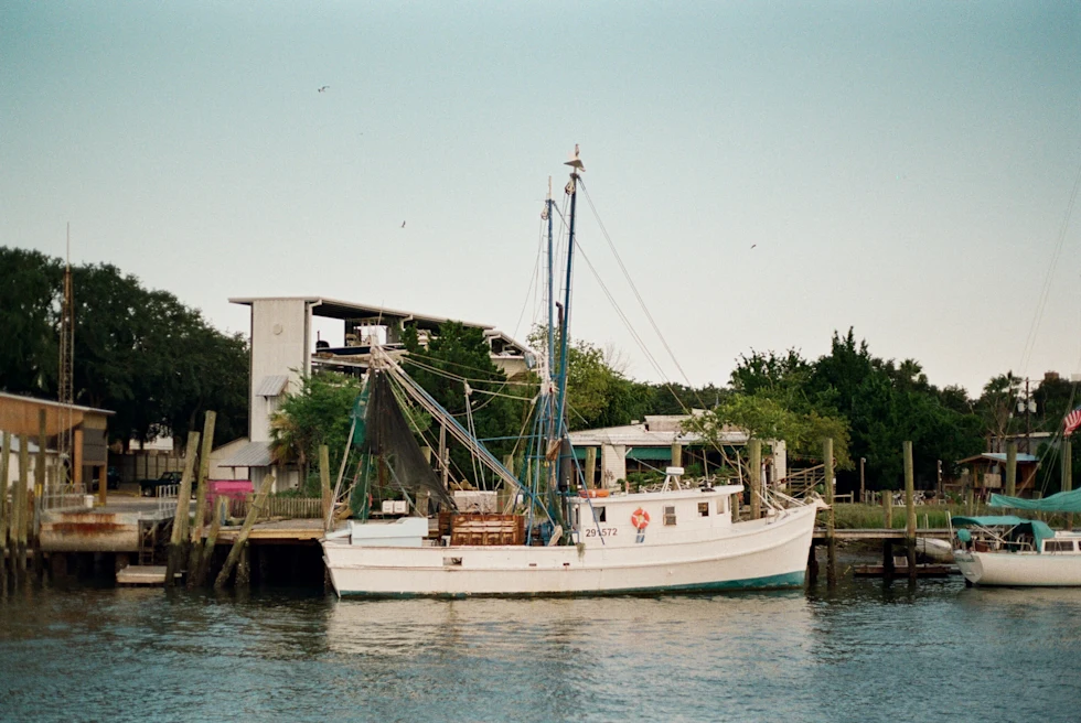 White boat in body of water during daytime