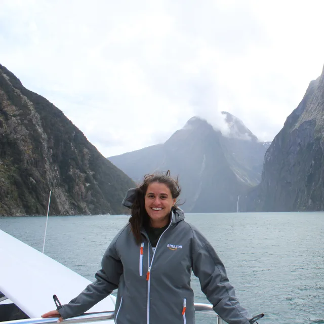 Picture of Catherine at Milford Sound / Piopiotahi in front of a lake and mountains