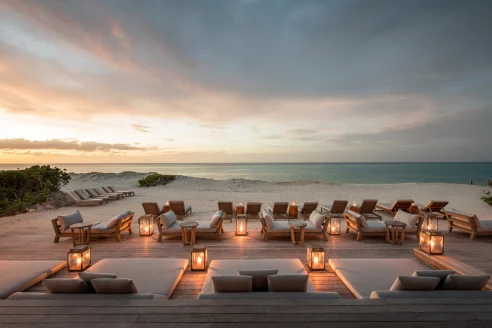 day beds surrounded by lanterns overlooking the Caribbean