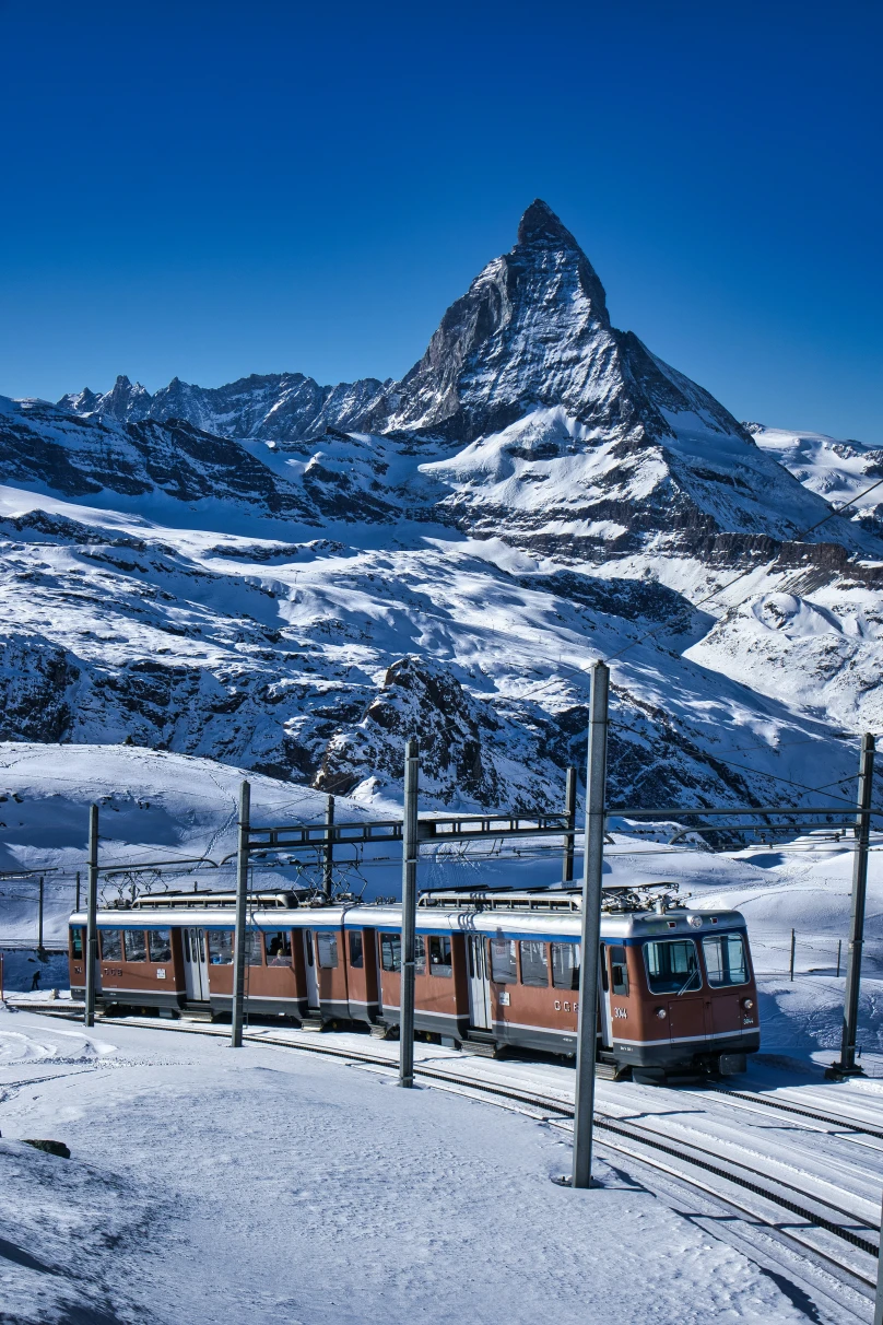 train traveling through snowy mountain