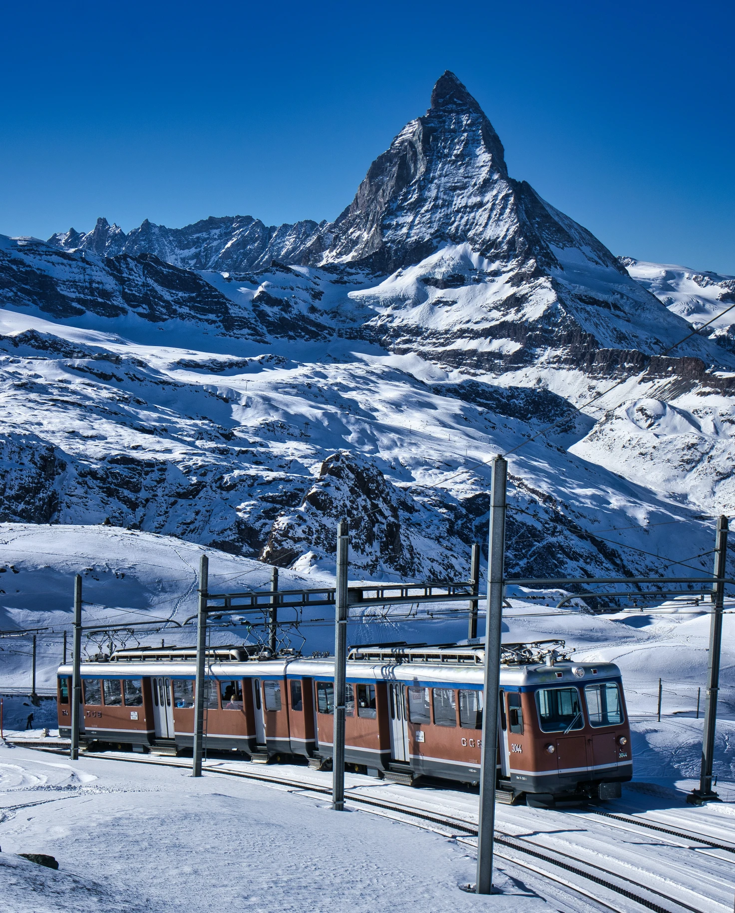 train traveling through snowy mountain