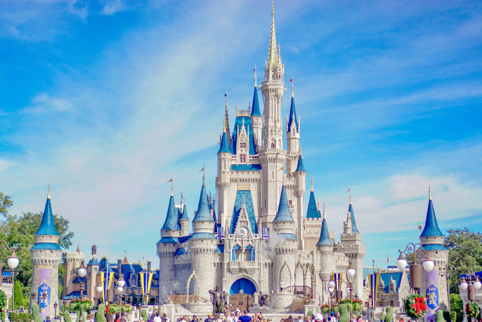 White and blue castle with blue skies during daytime