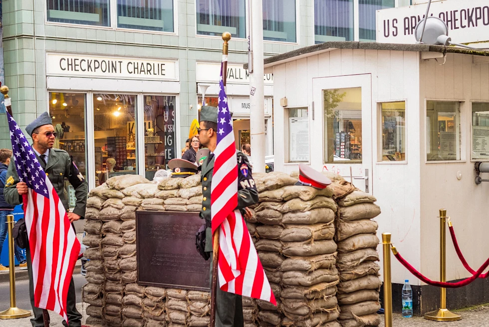 two American flags next to building