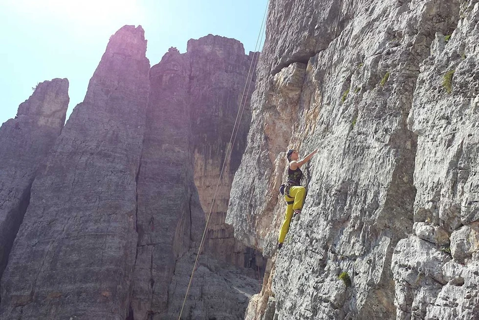 A man is dong rock climbing.