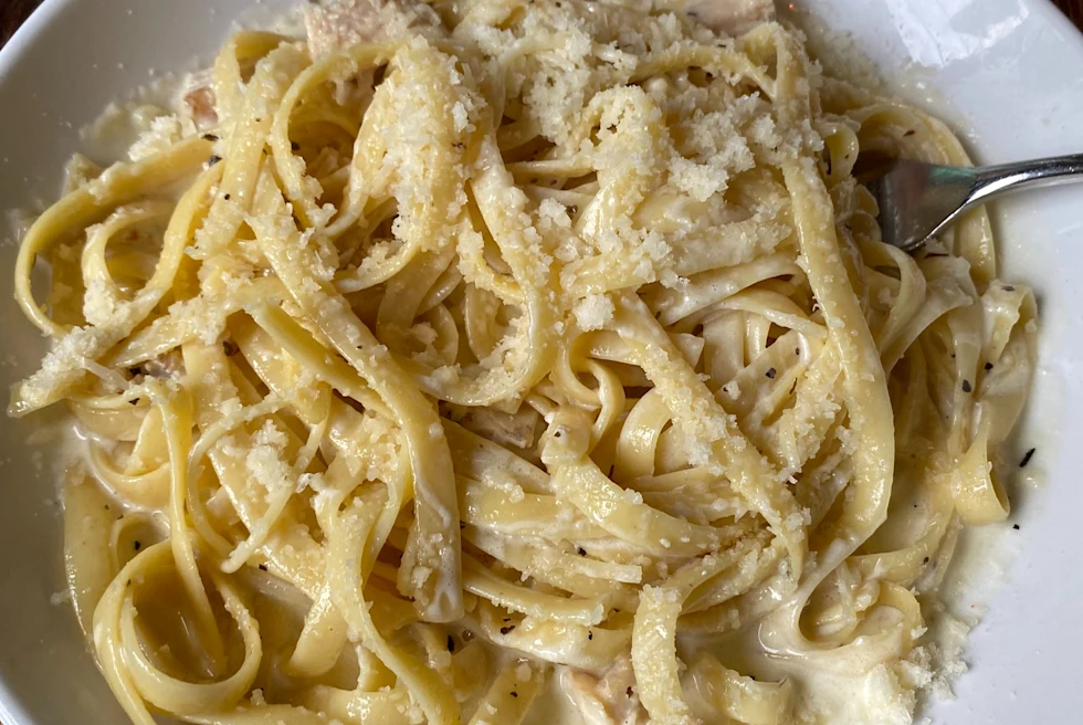 Pasta served on a plate.