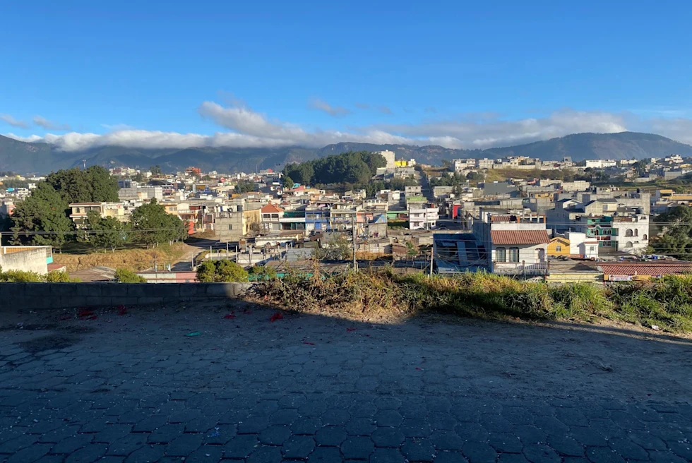 city beneath a mountain range