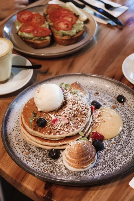 plate of pancakes on a wooden table