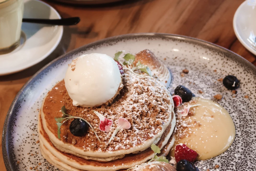 plate of pancakes on a wooden table