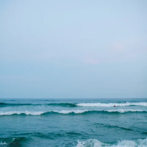 ocean waves rolling onto a beach