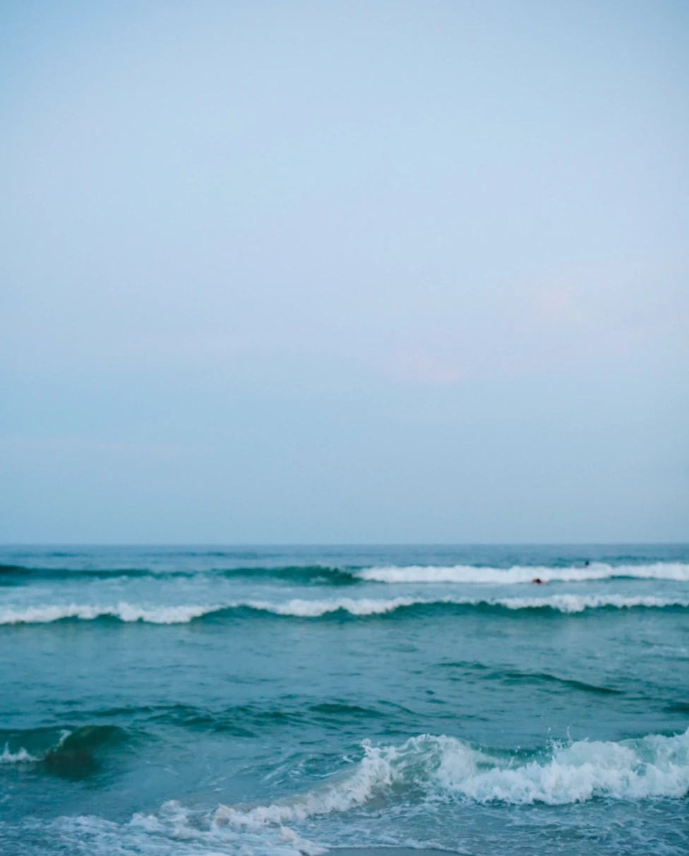 ocean waves rolling onto a beach