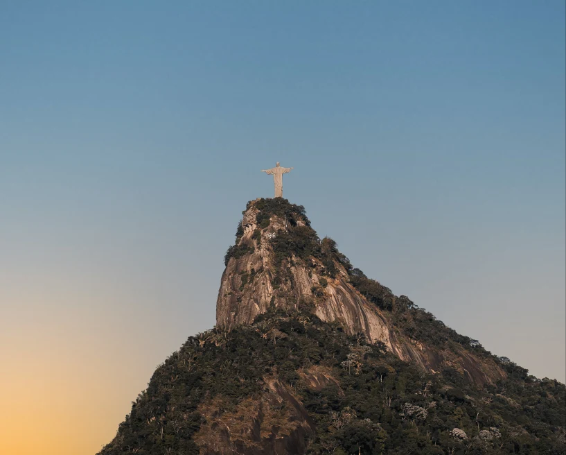 View of Christ the Redeemer statute on top of mountain in Brazil