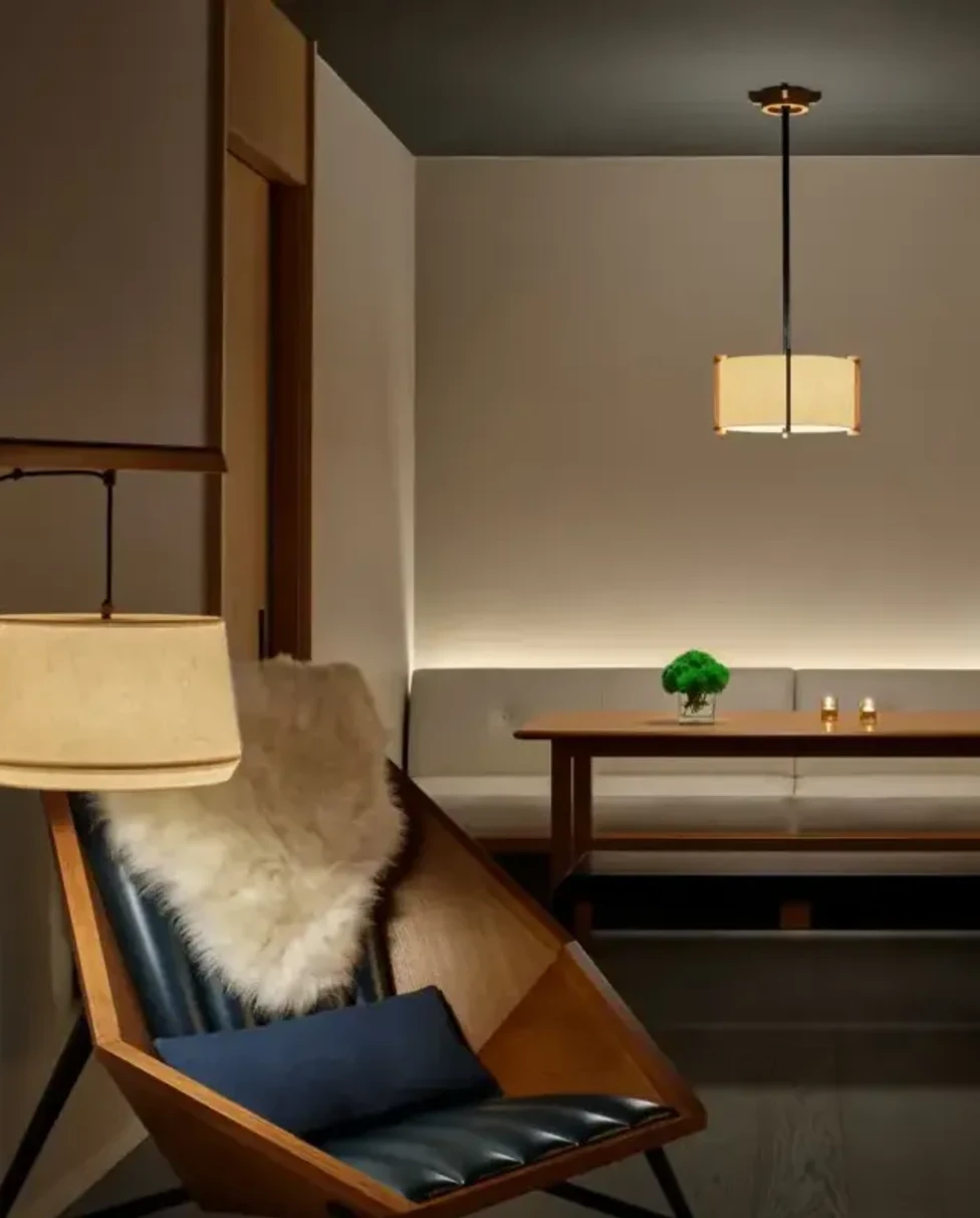 a geometric chair near a lamp in a sleek room 