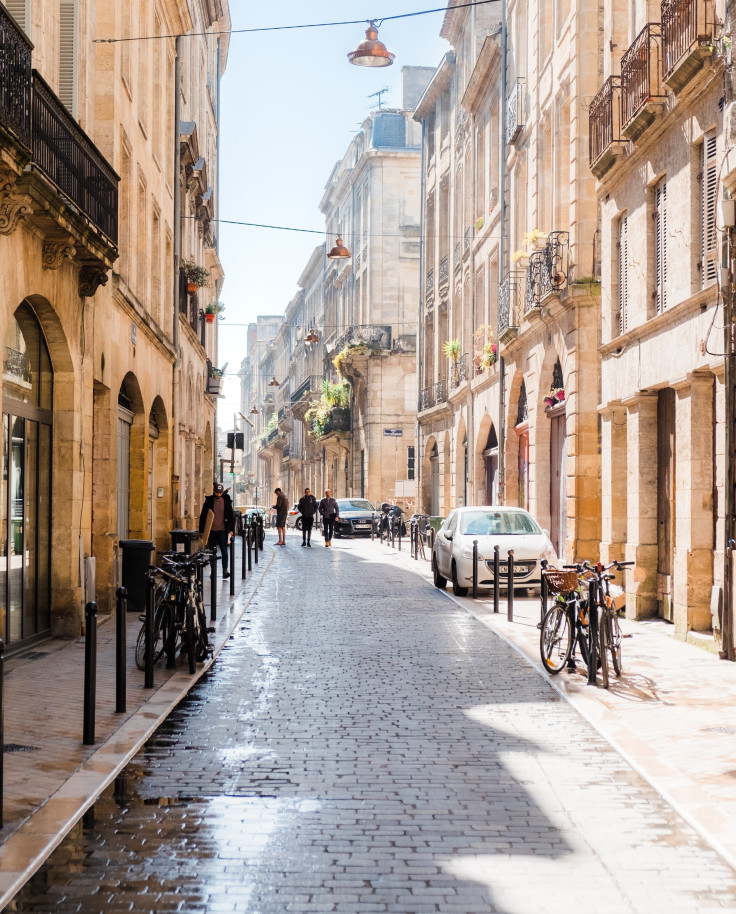 Cobblestone street with buildings and bicycles