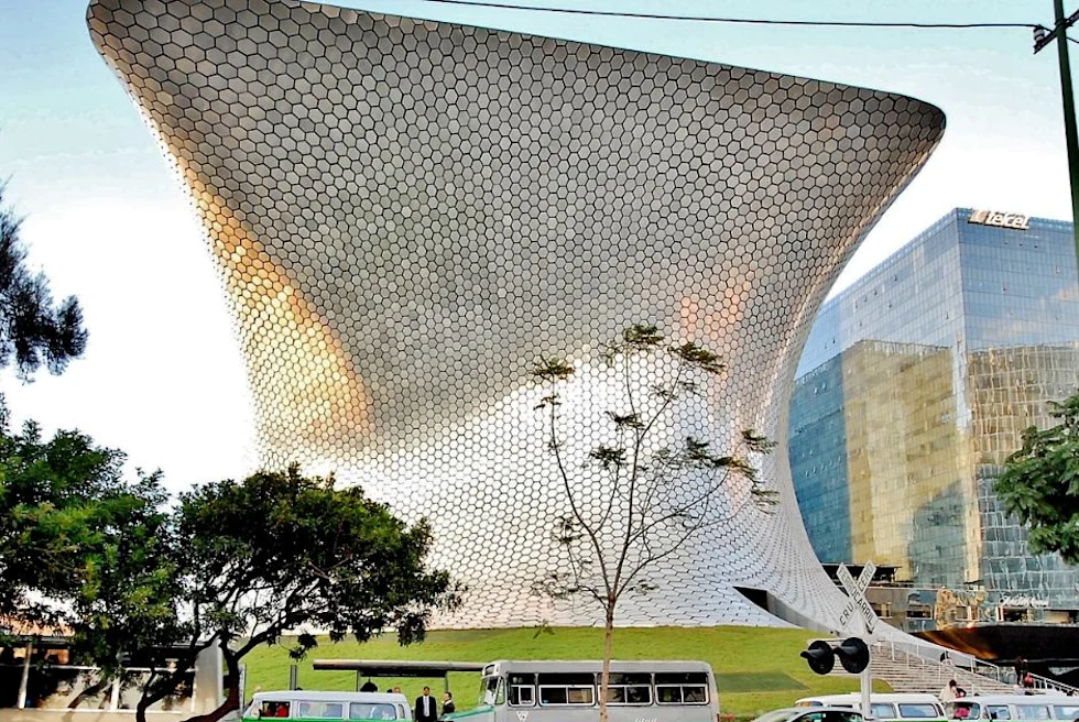 aerial view of buildings with mountains in the background