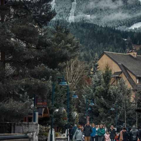 A group of people walking at Whistler Village.