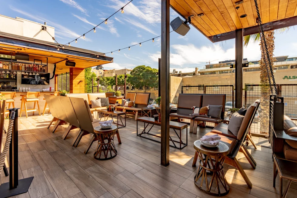 outdoor seating area with wooden floors and canopy