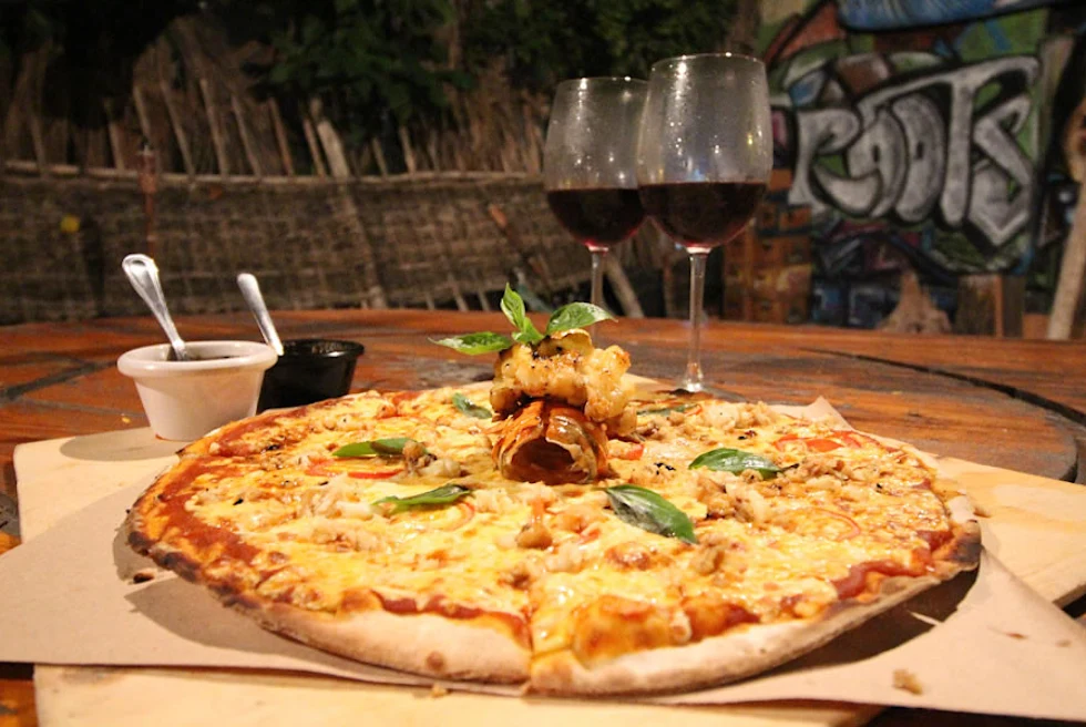 Roots is one unique place that offers lobster pizza.